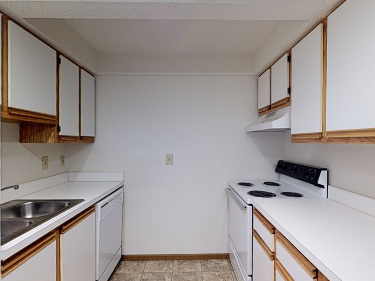 Image of a kitchen with cabinets and appliances